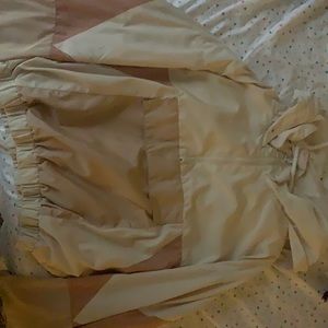 Here’s is a track coat, light pinks and biege